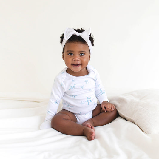 STARRY TIDE LONG SLEEVE BODYSUIT  A favorite from first wear